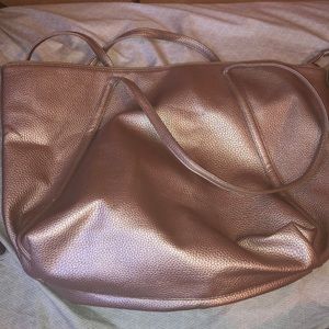 Rose gold purse with a lot of room